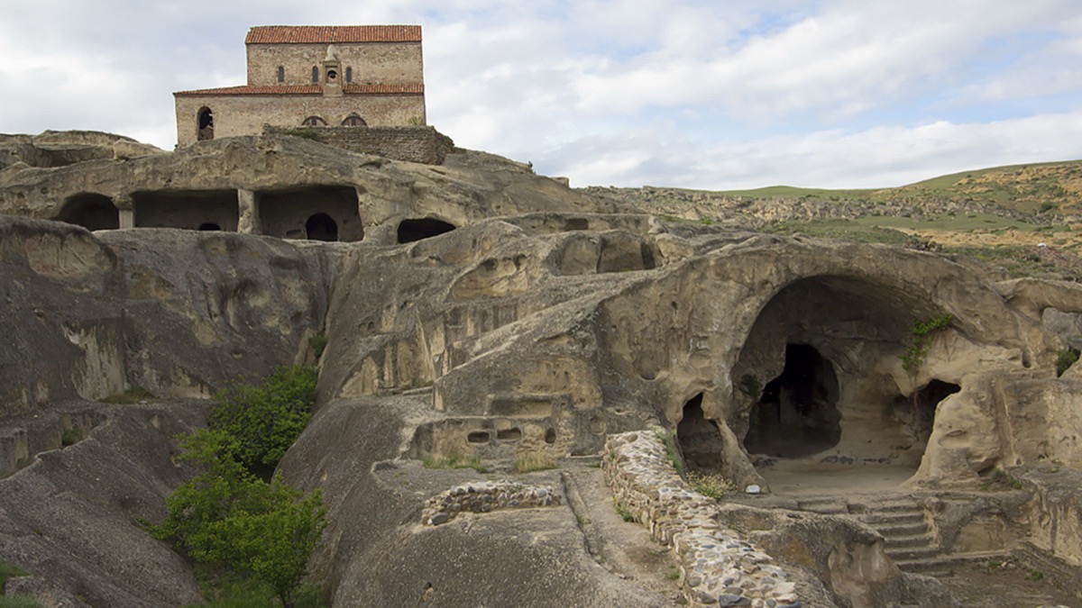 Uplistsikhe cave city carved into sandstone cliffs